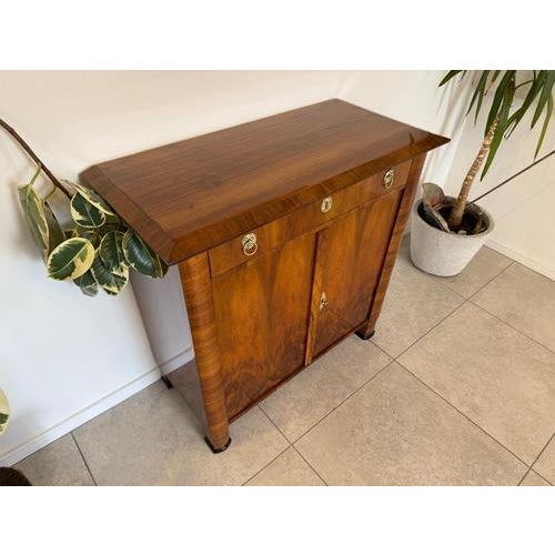 Restored original Biedermeier trumeau sideboard. Dimensions: Height x Width x Depth 96 x 96 x 46 cm. For sale is a...