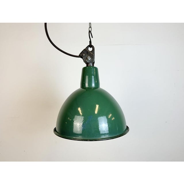 Industrial green enamel pendant light made by A23 factory in Wilkasy in Poland during the 1960s. White enamel inside the...