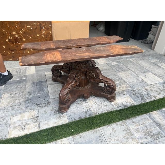 Discover the craftsmanship of the 19th century with this large carved center table, a true testament to the artistry of...