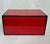 Lacquer trinket box in a striking Chinese red color with black border trim. Finished in several layers of lacquer, giving...