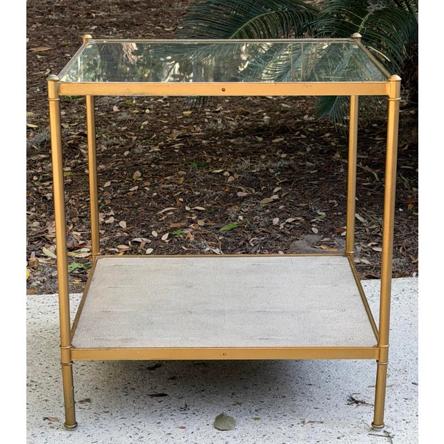 Elegant Lillian August Anton side table with eglomized mirrored top with gold accent stripe and a textured pearl gray...