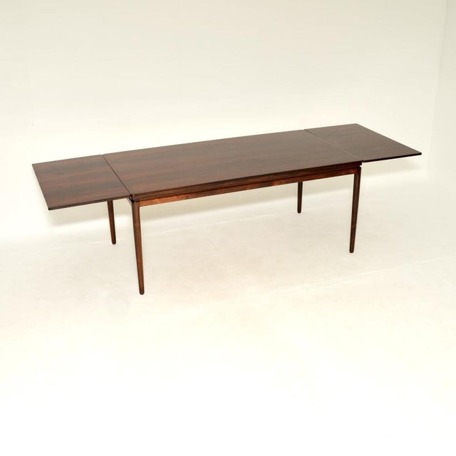 An absolutely stunning Danish vintage extending dining table by Johannes Andersen. It is of superb quality and is a great...