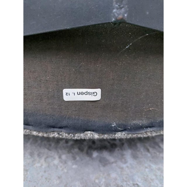 The chair is in original condition. The black leather armchairs have a few visible damages on the fabric ( please look at...