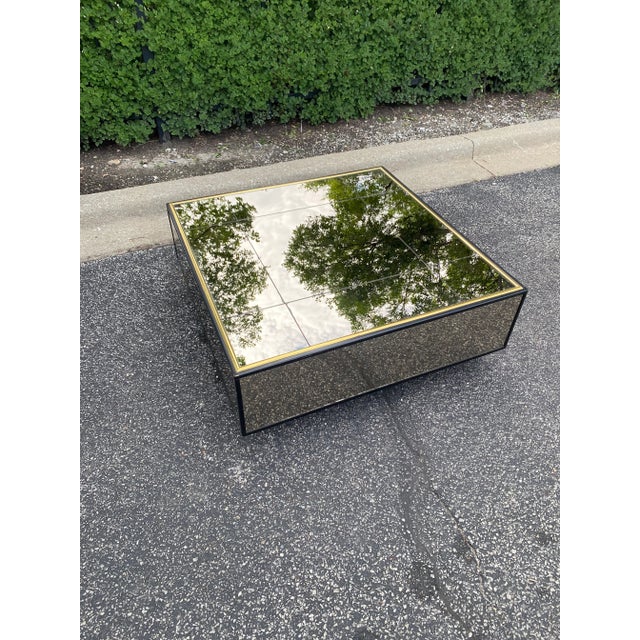 Vintage late 1970s-1980s mirrored coffee table with gold trim and a bold, low-profile plinth base—pure Studio 54 energy....