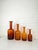A striking graduated set of four amber gulvvase vases designed by otto brauer for holmegaard, denmark. designed in 1962,...