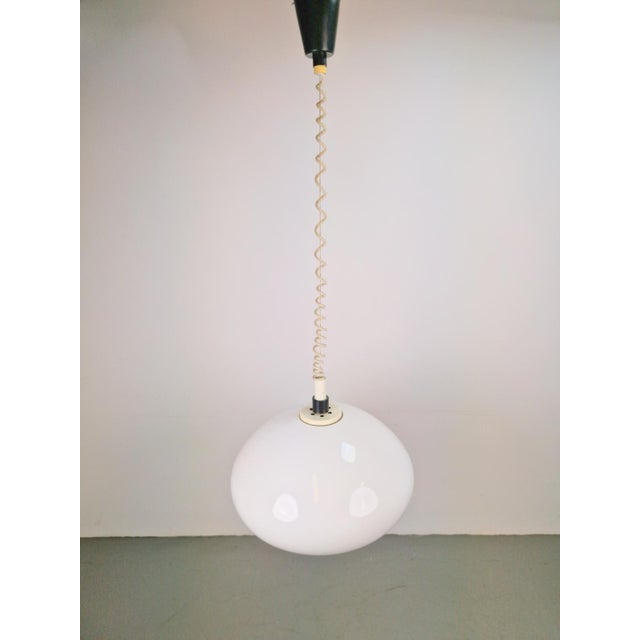 Adjustable Pendant Lamp with Pull Cord by Gepo Vintage pendant lamp by Gepo. Beautiful lamp with a large white plastic...