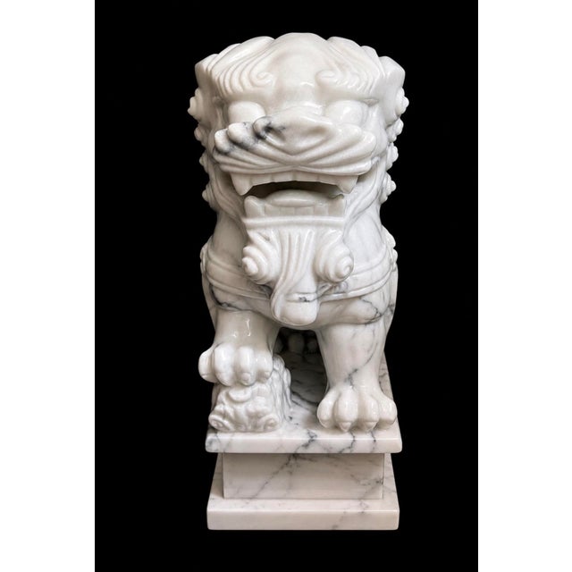 Exceptional pair of monumental hand-carved solid marble Japanese guardian lions, also known as Komainu or Foo Dogs,...