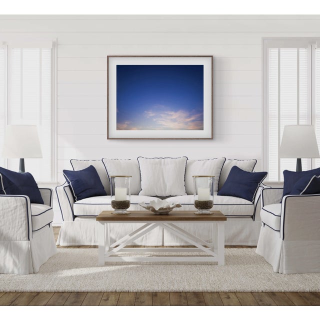 This fine art photograph by Paula McIntosh features wispy pink clouds on a clear blue evening. The start of a stunning...