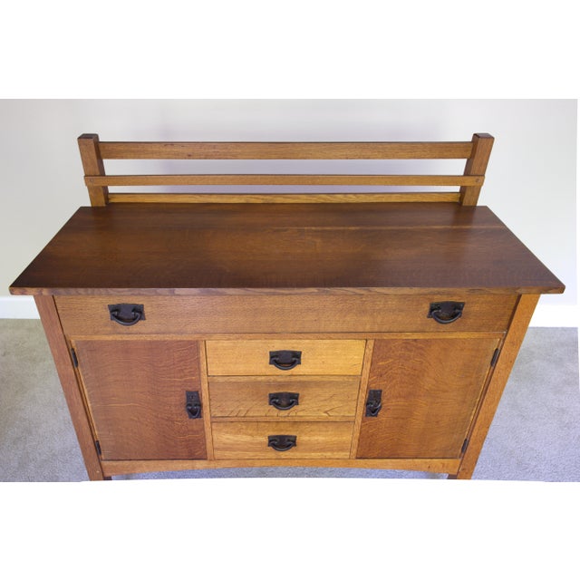 A genuine Gustav Stickley Model 816 sideboard from the Craftsman Workshop's peak production period, bearing the original...