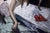 Contemporary Red Shoes by Nadezda | Oil on panel Painting of a woman reaching for red shoes in a room. For Sale - Image 3 of 5