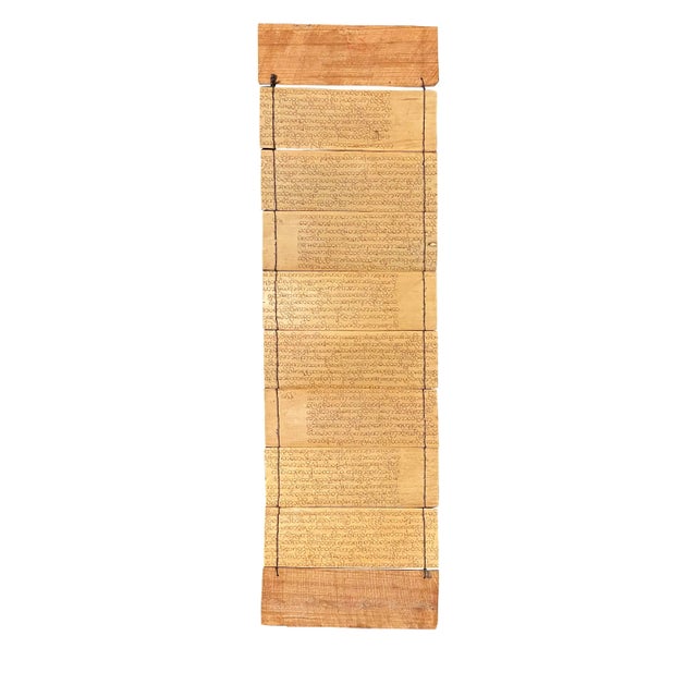 Burmese folding book with a carved cover. Two-sided engraved palm leaves depicting animals of the zodiac with other...