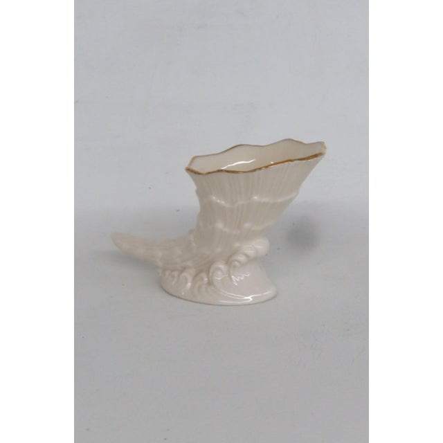 This charming Cornucopia Figurine is made of porcelain. This lovely small figurine is stamped as being made in the USA by...