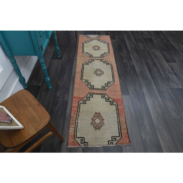 Vintage Hand-Knotted runner rug is a semi-antique vintage runner rug. The '70s Eastern region of Anatolia's unique rug is...