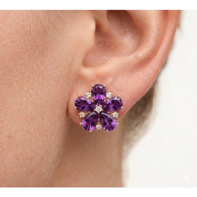Bring a touch of regal elegance to your jewelry collection with these captivating Amethyst Flower Stud Earrings. Designed...