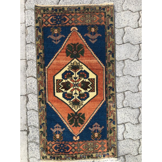 This is a vintage Turkish Oushak rug from the 1960s. The piece was hand-knotted.