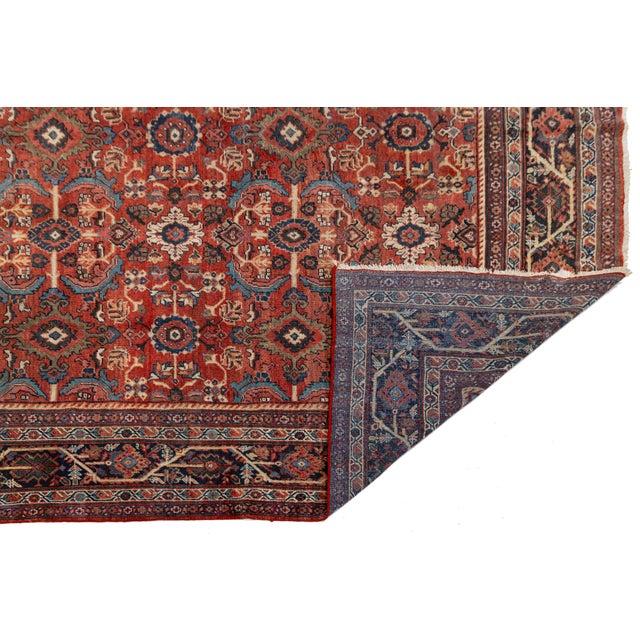 Elevate your space with this authentic, hand-knotted Vintage Mahal rug. Crafted from high-quality, hand-spun wool on a...