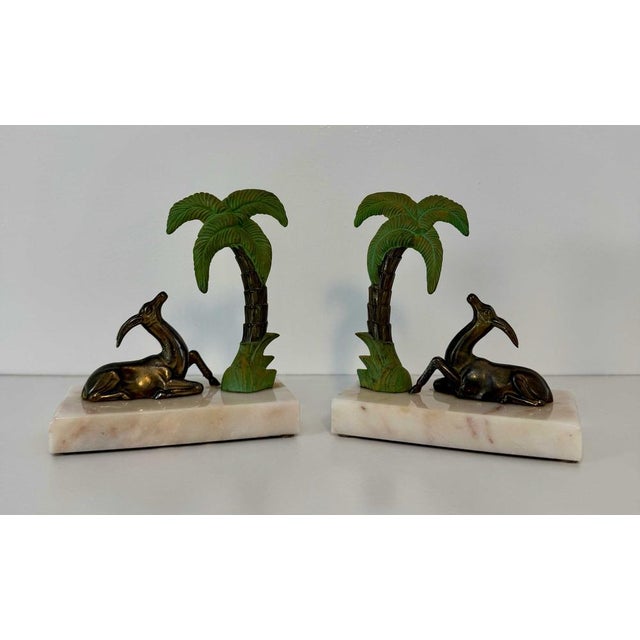 Elegant pair of French Art Deco bookends produced in France during the 1930s. Each bookend features a reclining gazelle...