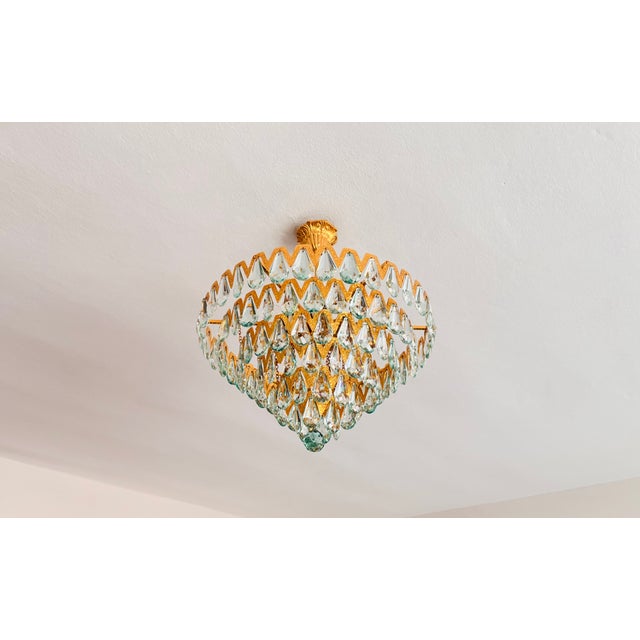 An extraordinary statement piece of lighting artistry, this 6-light flush mount chandelier combines natural, high-luster...