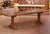Hand-crafted in southern France circa 1860, this substantial antique refectory table embodies the robust architectural...