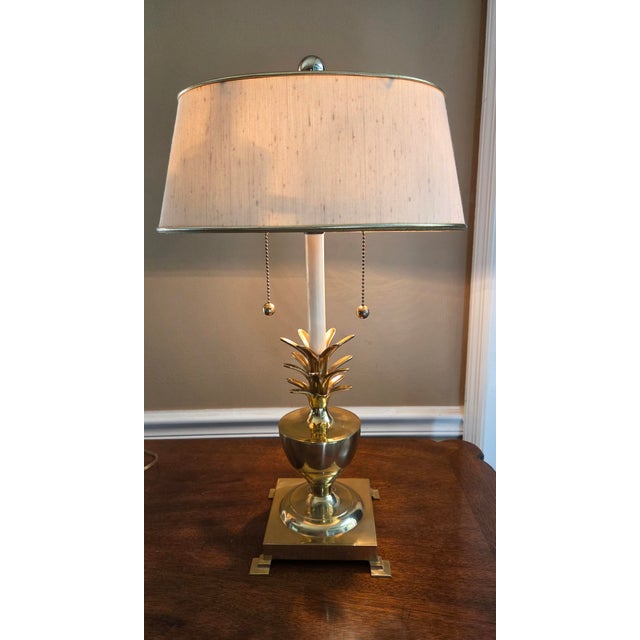 Large and heavy vintage brass pineapple table lamp. Oval Frederick Cooper silk shade is included.