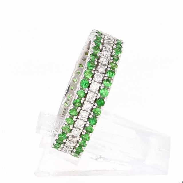 A cute and dainty Tsavorite and Diamond Band that is sure to be a great addition to your jewelry collection. This band has...