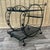 Vintage Mid Century Wrought Iron Marble Top Patio Serving Cart in the Salterini Style. Circa 1960s Features a wrought iron...