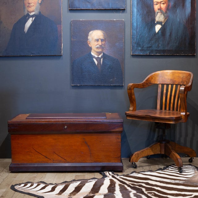 ABOUT A 19th-century marine or campaign chest features durable two-tone wood construction. Crafted from rich mahogany,...