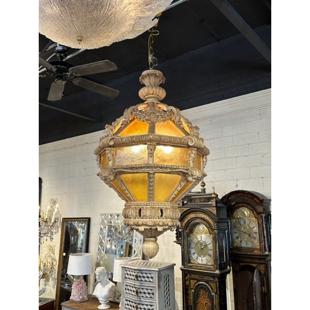 Large scale 19th century Italian carved and stripped wood lantern. Circa 1880. The chandelier has been professionally...
