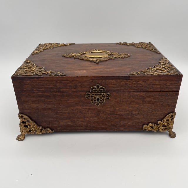 Remarkable late 1800s French Oak Dressing Box with ornate Louis XV Rococo style Brass Mounts and lion paw feet. Opening to...