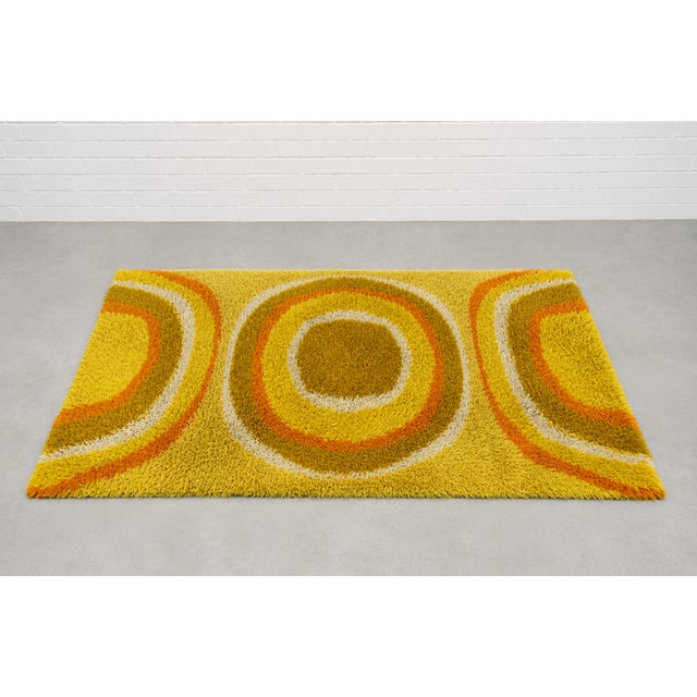 Mid Century Modern original 1970's rya rug brings instant warmth and personality to any space. Measuring approximately 5’...