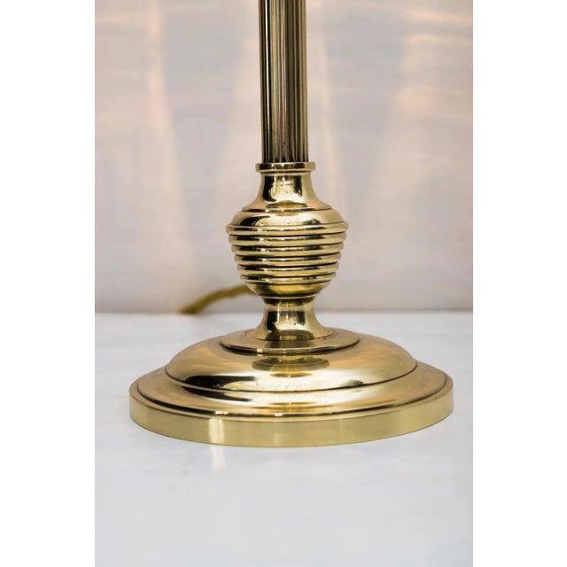 This Art Deco table lamp with an opaline glass diffuser is polished and stove-enameled. European Plug (up to 250V).The...