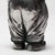 A Polish silver salt cellar in the shape of a figurine of a young porter, with hands tucked into pockets and a hat as a...