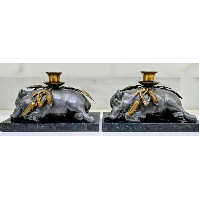 Charming vintage Petites Choses pewter sleeping pig candle holders, sold as a matched pair and mounted on rich green...