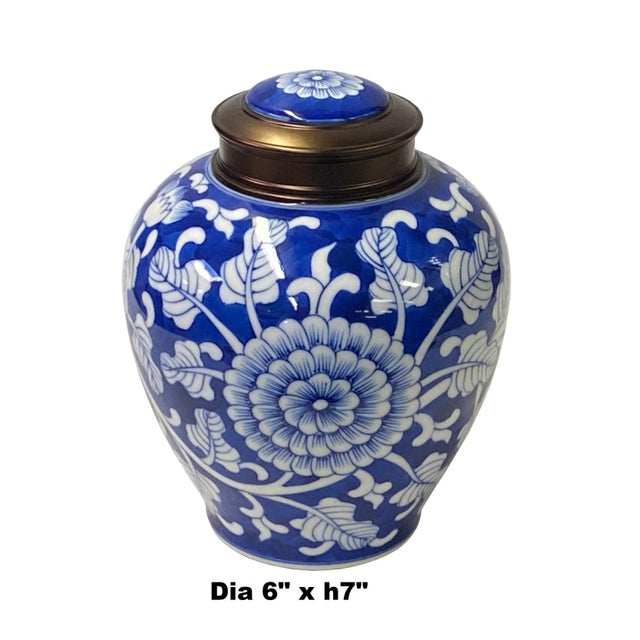 This is a quality handmade porcelain box container urn with a metal lid. The handpainted white color floral graphic...