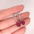 These beautiful dangle earrings feature a pair of 8.19 carat weight oval Ruby gemstones with natural earth mined diamonds...