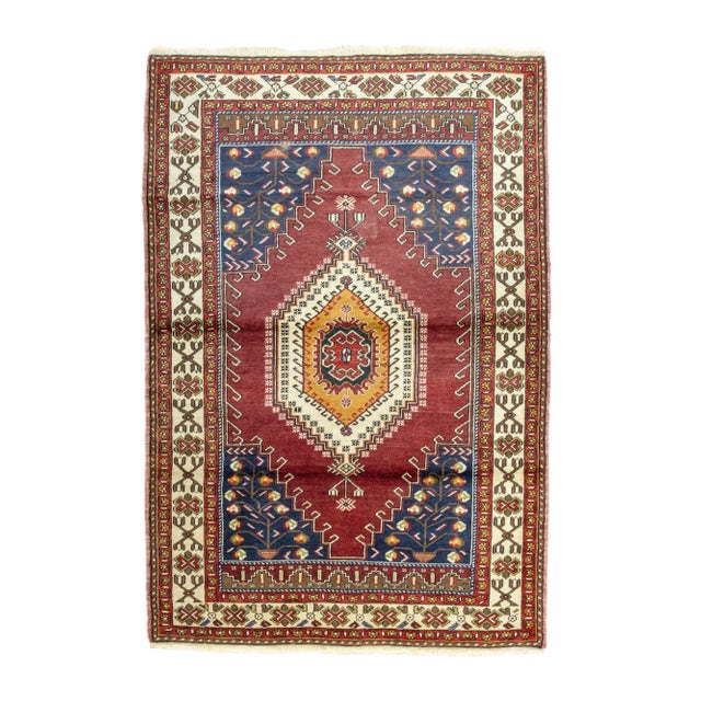 Step into a world of timeless craftsmanship with this captivating vintage Turkish village rug, hand-knotted with...
