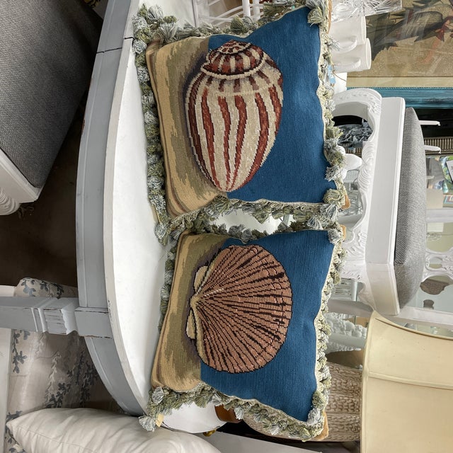 Pair of stunning needlepoint throw pillows with velvet backing and tassel fringe trim. The pair feature a cobalt blue and...