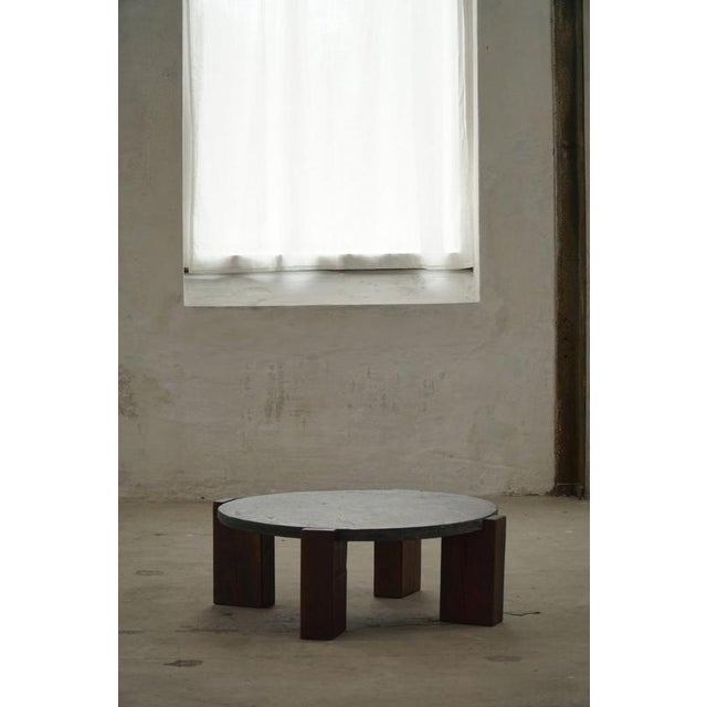 Round coffee / side table with solid oak legs and a nice slate stoneware top. Made by a French cabinetmaker in the 1970s....
