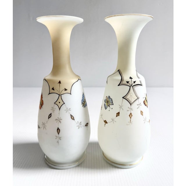 Elegant pair with beautifully hand painted flowers, berries and butterflies. They are not exactly the same, the design is...