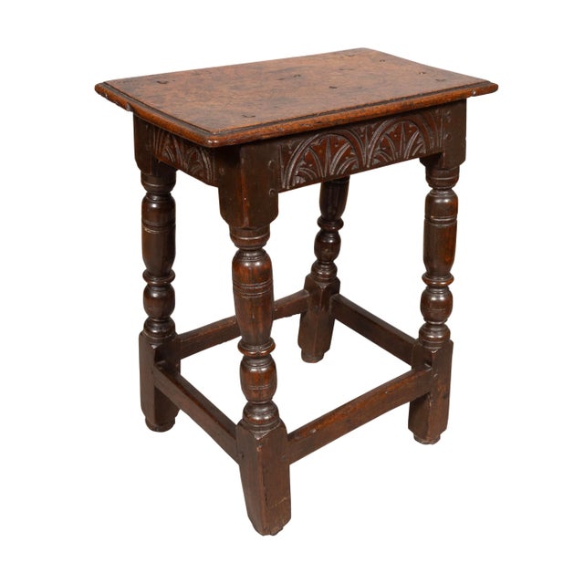 Jacobean Oak Joint Stool rectangular original top over a lunette carved frieze and raised on turned legs joined by a box...