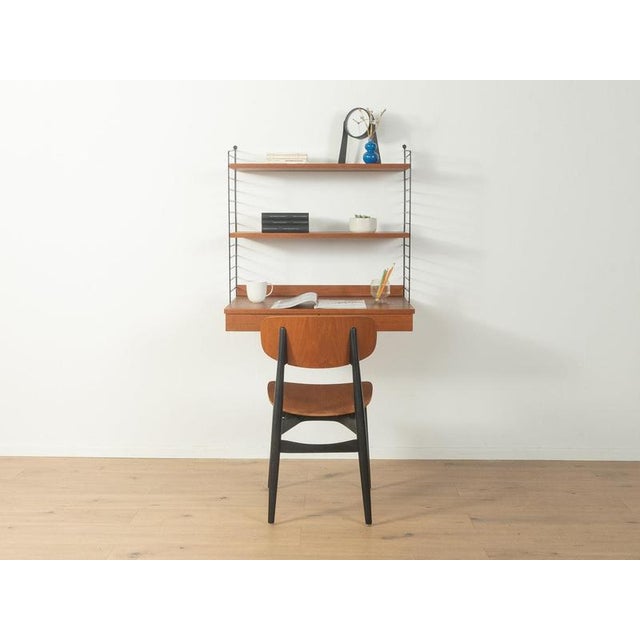 1950s wall shelf, nils strinning high-quality veneer 2 cm thick shelf boards made of particleboard, which prevent...