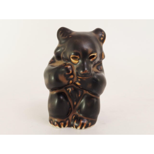 Charming trio of stoneware bear figurines designed by Knud Kyhn for Royal Copenhagen in the 1940s. The figures are...