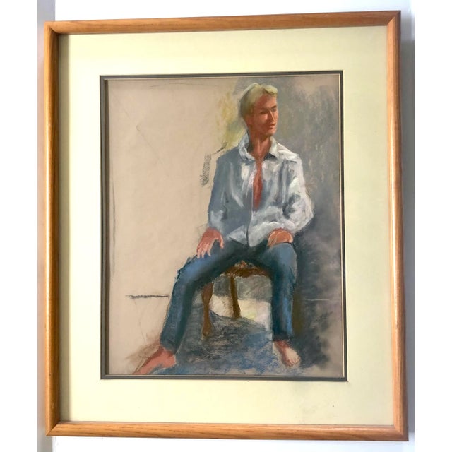 Purchased at the estate of the artist, this pastel portrait of an attractive young blonde man seated in a chair. The...