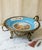 Large antique 19th-century Sèvres-style porcelain centerpiece featuring a celestial blue ground with hand-painted floral...
