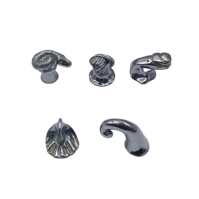 Set of 5 decorative handles or knobs for furniture, featuring artistic designs. The pieces are attributed to Annibale...