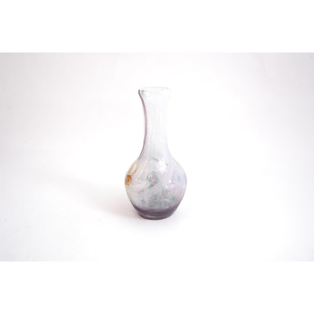 Daffodil vase manufactured in the Bohemen. The acid-etched decoration of this peace of double glass has been enhanced by...