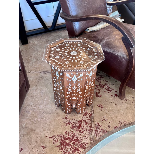 Celebrate the enduring beauty of traditional Syrian craftsmanship with this exceptional vintage octagonal accent table....