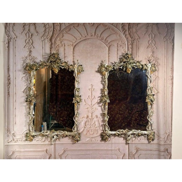 A rare and enchanting pair of Bacchic mirrors, evoking the opulence of a Tuscan vineyard and the romance of 18th-century...