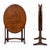 A charming Arts & Crafts oak folding wine table, featuring a beautifully grained oval top and an elegant folding frame....