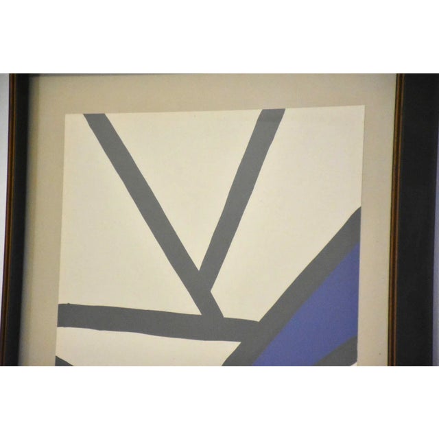 A mid century modern abstract lithograph by Alexander Calder. Measurements are of the frame. 15.5” wide. 19.5” tall.